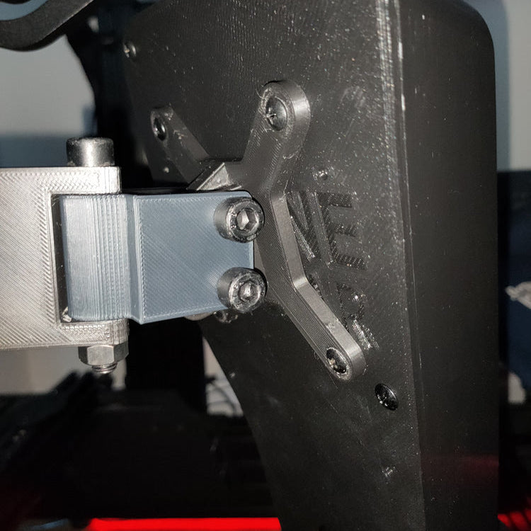 Button box securely mounted to a sim rig using the adjustable arm, demonstrating angle customisation for optimal reach and visibility.