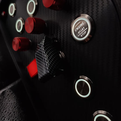 Close-up of red machined aluminium rotary encoders and white LED Engine Start button on the GT Red.