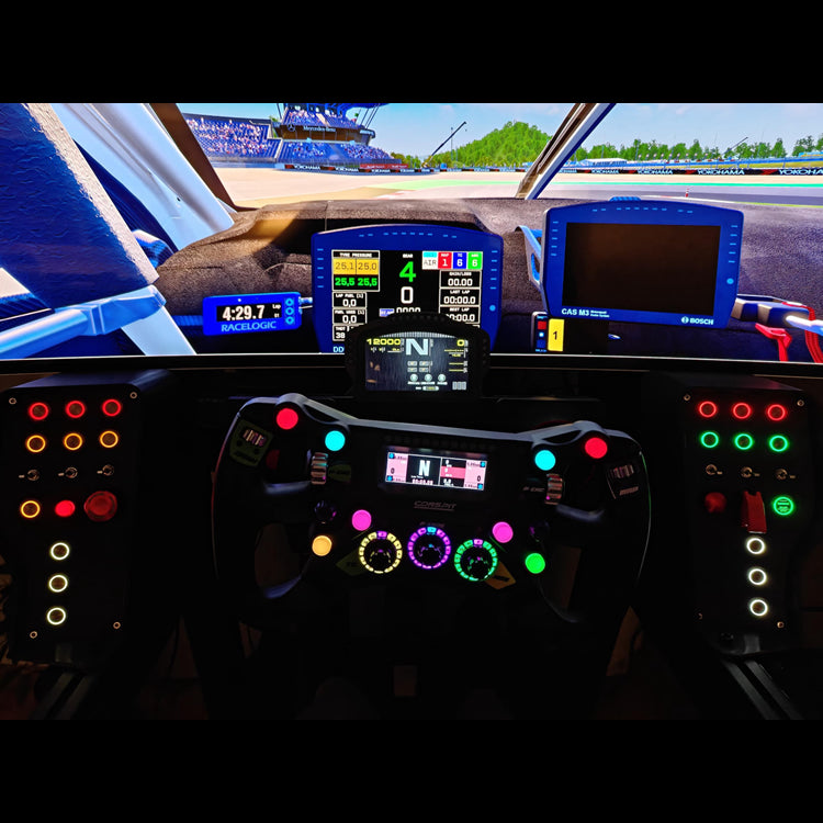 Simulator dashboard with a widescreen and two OSG button boxes, showing a racing game interface.