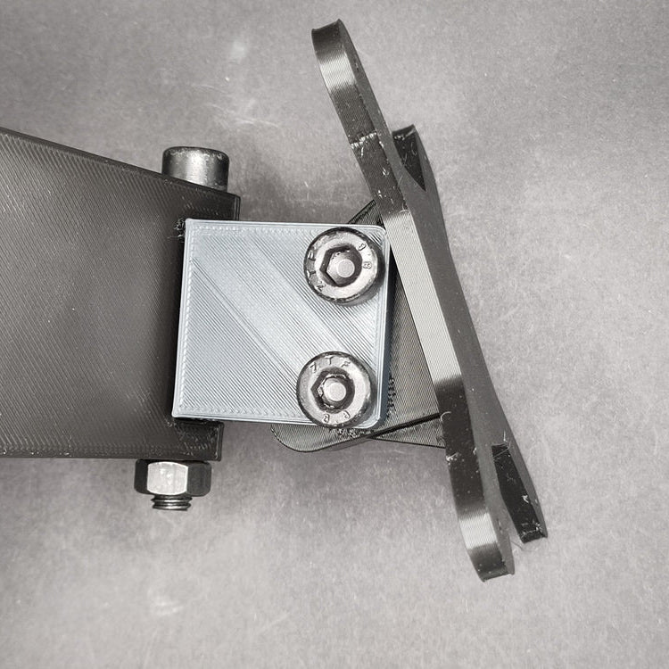 Button box mounting plate swivelled 45 degrees to the left, showing flexible angle adjustment for an ergonomic and accessible racing setup.