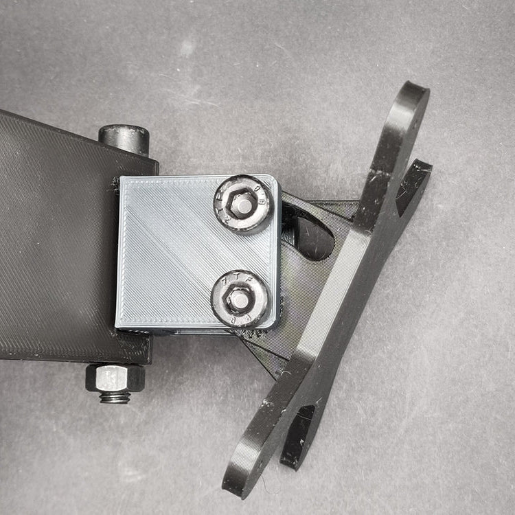 Close-up of the button box mounting plate, angled 45 degrees to the right, highlighting its full swivel range for personalised button box positioning.