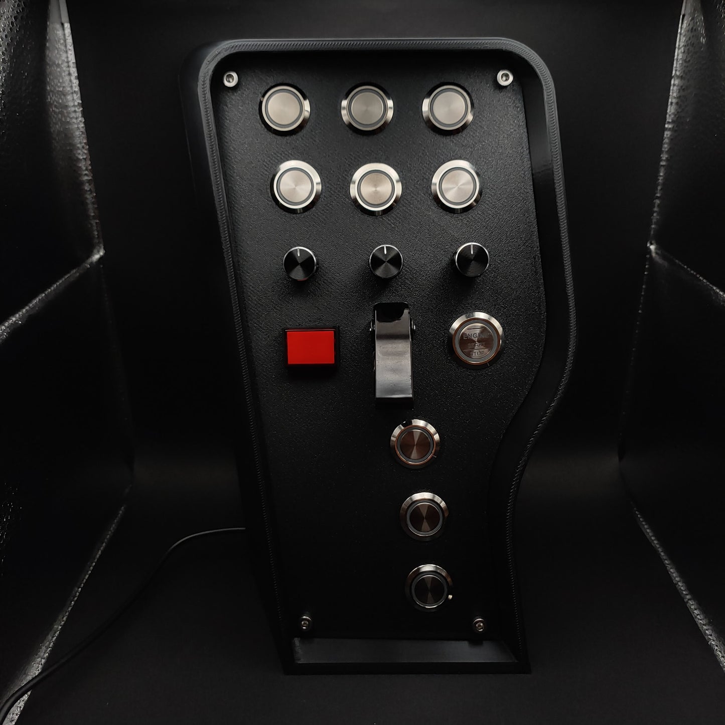 Front view with red LEDs powered off, highlighting the contrast between the matte faceplate and the distinct chrome buttons.