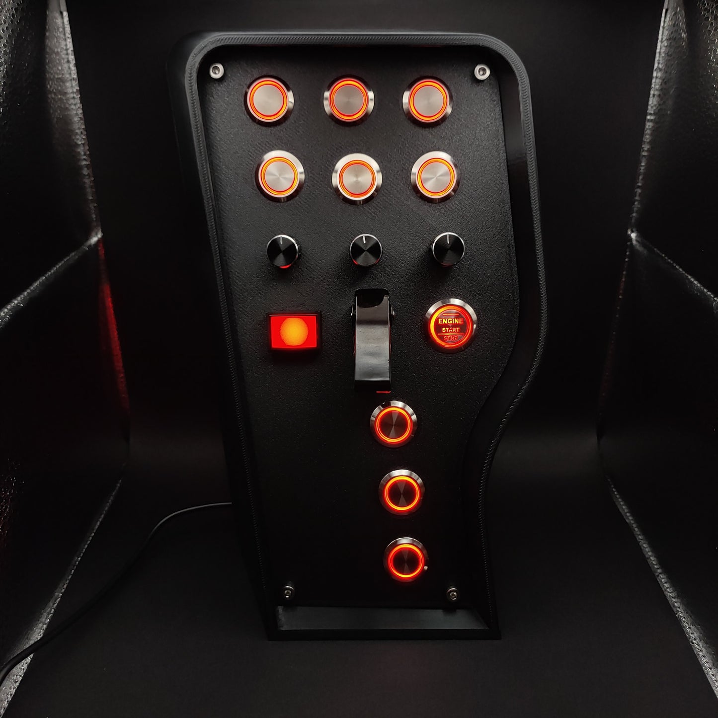 Front view of the Classic - Red Edition button box with a matte textured panel, featuring 10 vibrant red LED buttons and a central red emergency button.