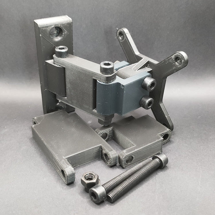 Short configuration of the adjustable sim rig arm, using a single joint for compact button box placement. Extra joints and hardware shown in foreground.