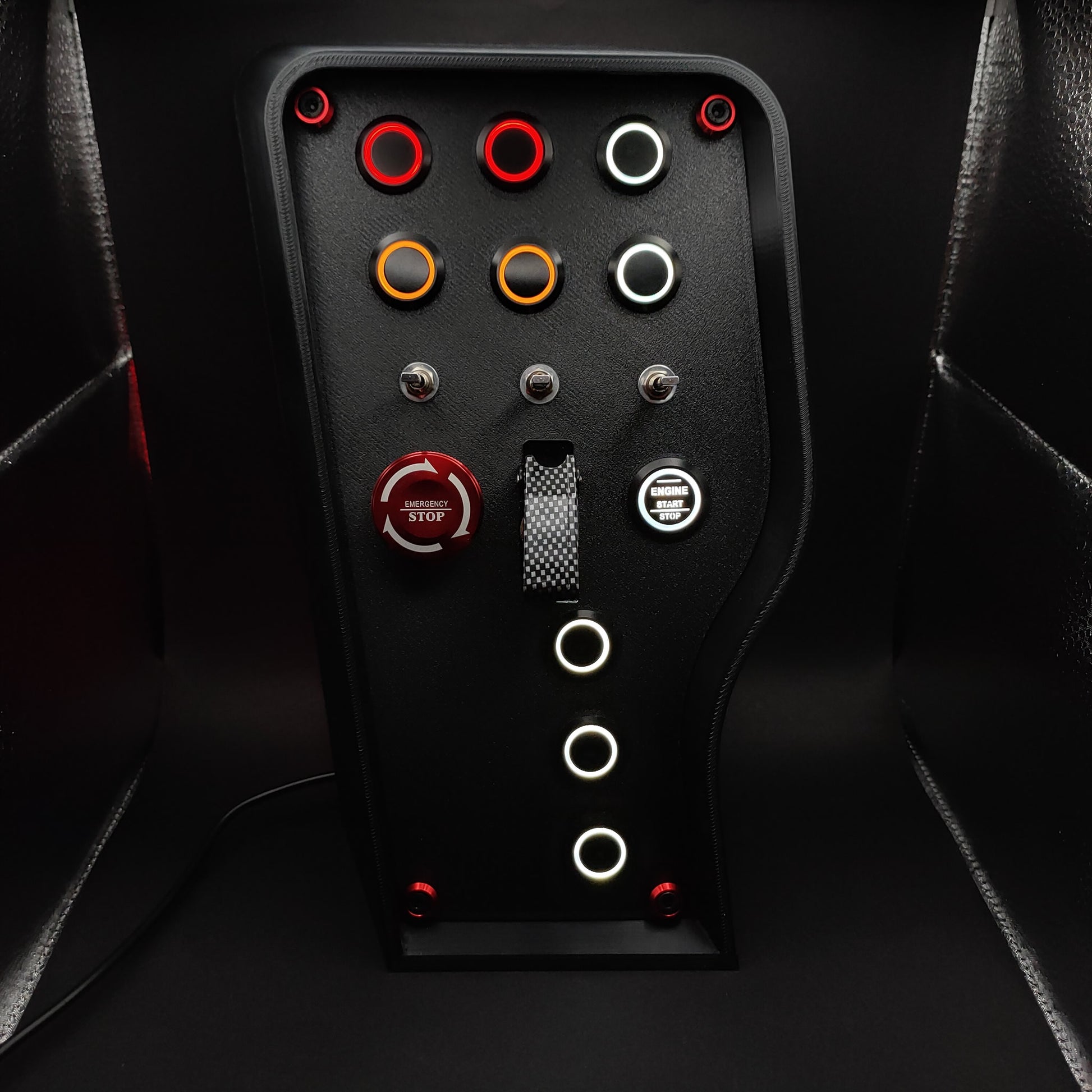 OSG Nürburgring Edition button box with industrial 3-way toggles and a carbon fibre toggle cover.
