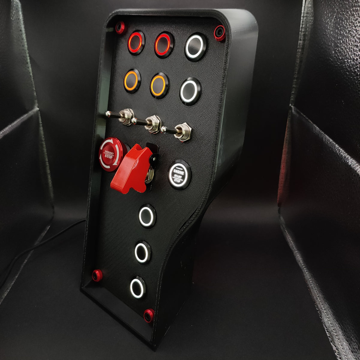 Left perspective of the Nürburgring box highlighting the red anodised bolt trim and 3-way toggles.