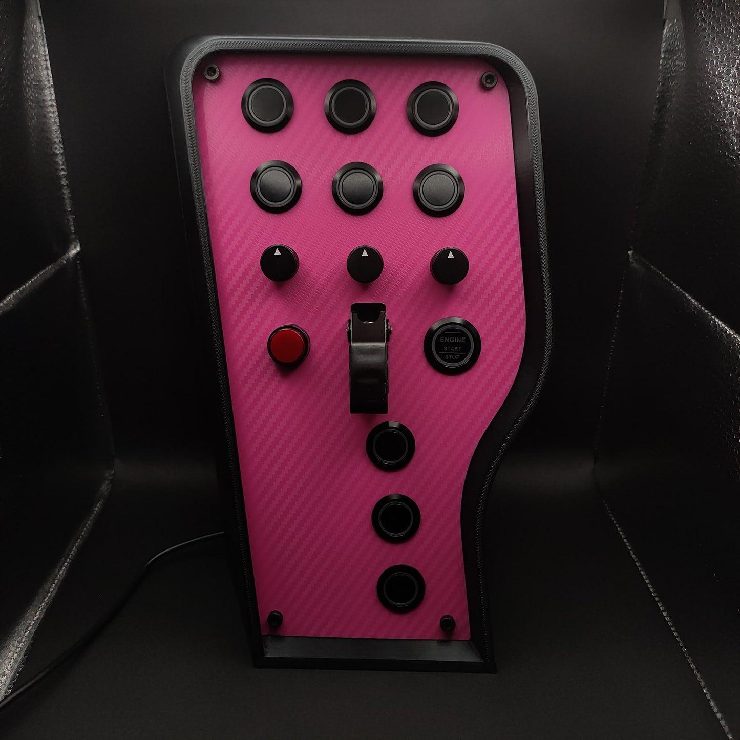 Pink Edition sim box showing black anodised encoders and pink carbon fibre finish (LEDs off).