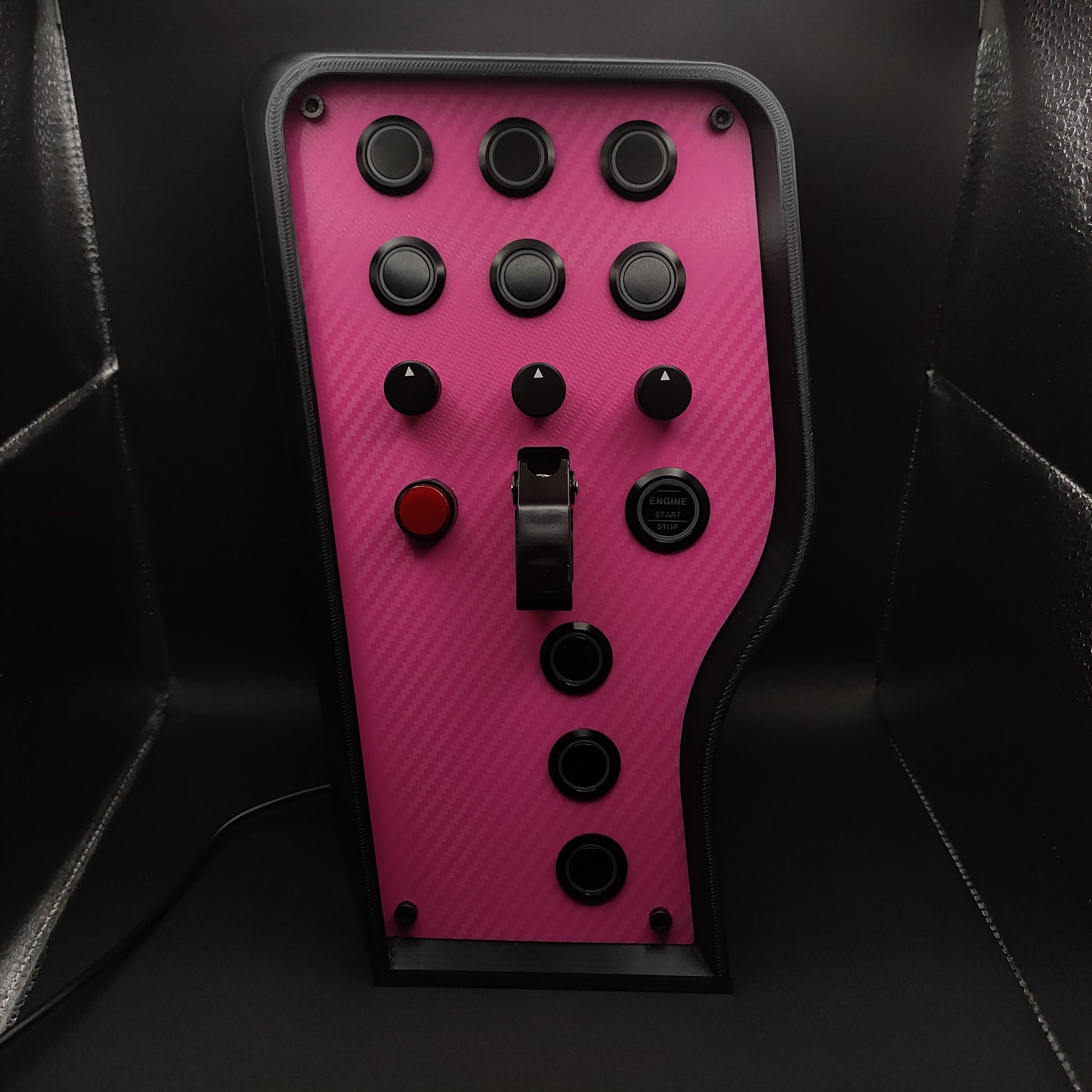 Pink Edition sim box showing black anodised encoders and pink carbon fibre finish (LEDs off).