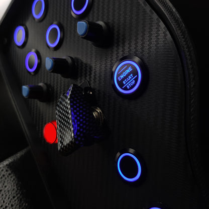 Close-up of black textured rotary encoders and blue LED Engine Start button on the Sport Blue edition.