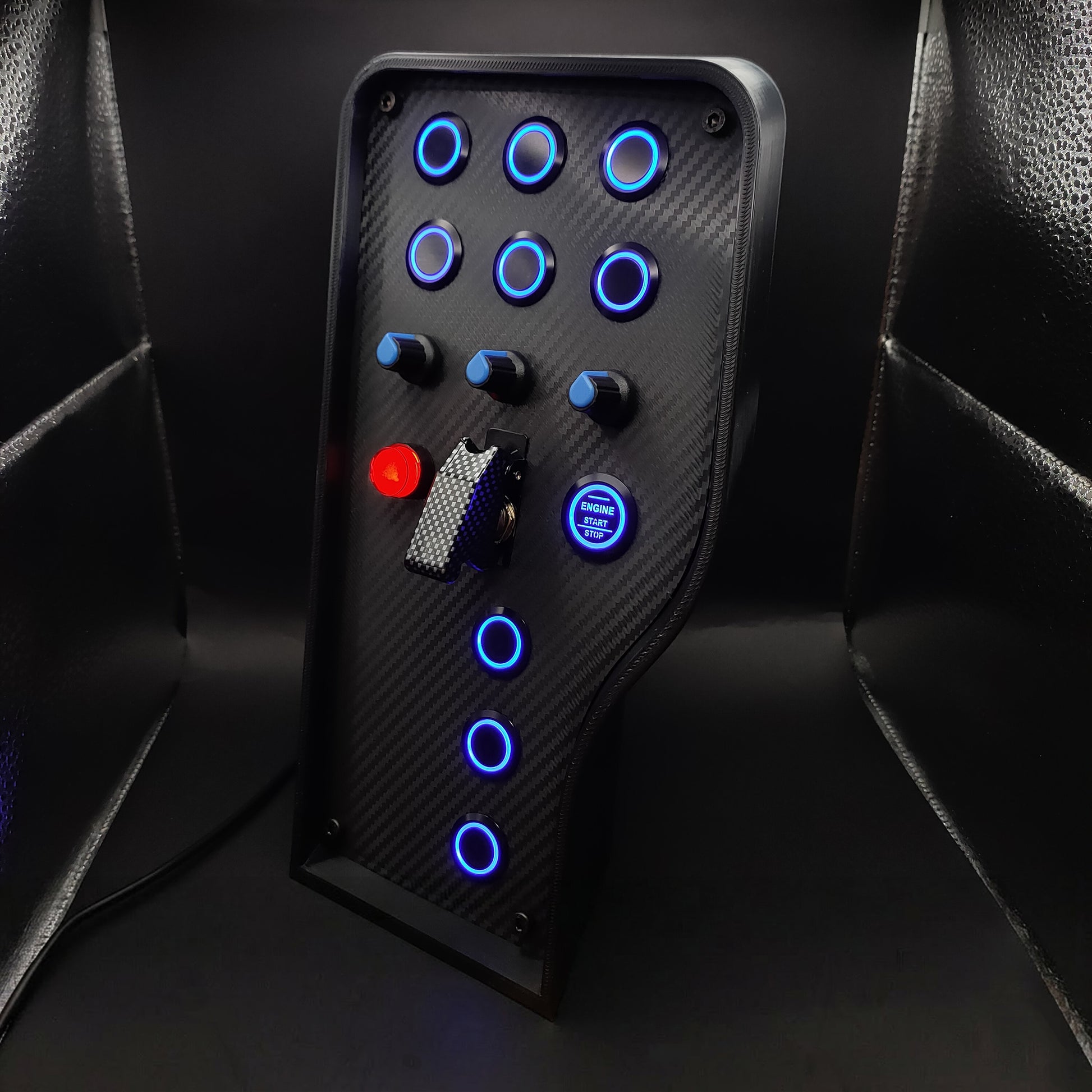 Left perspective of Sport Blue button box showing high-grip black rotary encoders and carbon fibre finish.