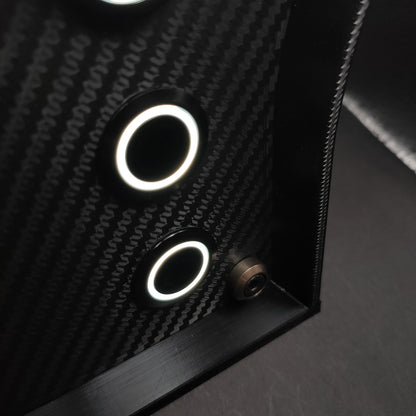 Detail shot of gunmetal grey anodised aluminium hardware on a premium carbon sim racing button box.
