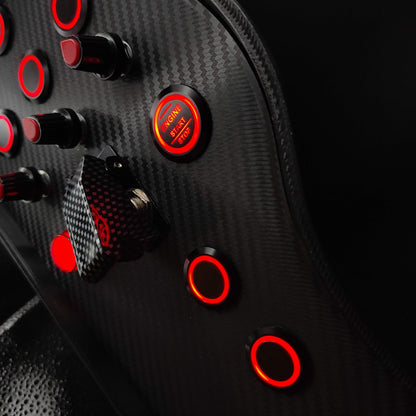 Detail shot of black textured rotary encoders and red LED Engine Start button on Sport Red edition.