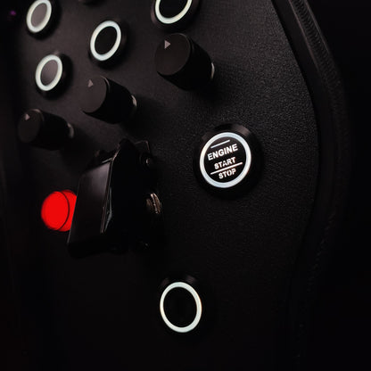 Close-up of black machined aluminium rotary encoders and white LED start button on Purple Edition.