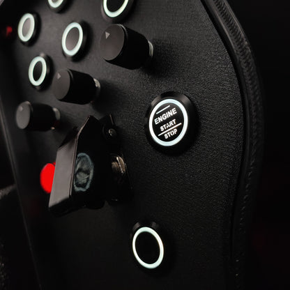 Close-up of black machined aluminium rotary encoders and white LED start button on Red Edition.